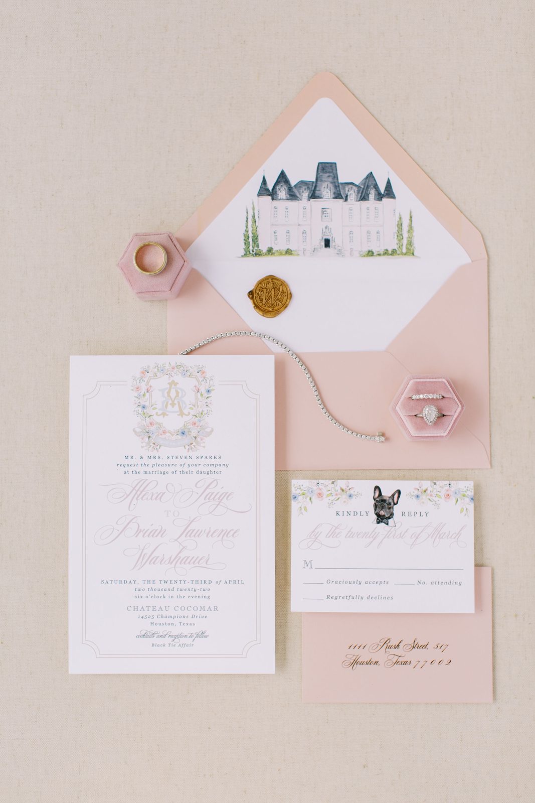 Alexa and Brian's wedding invitation suite with rings and a bracelet