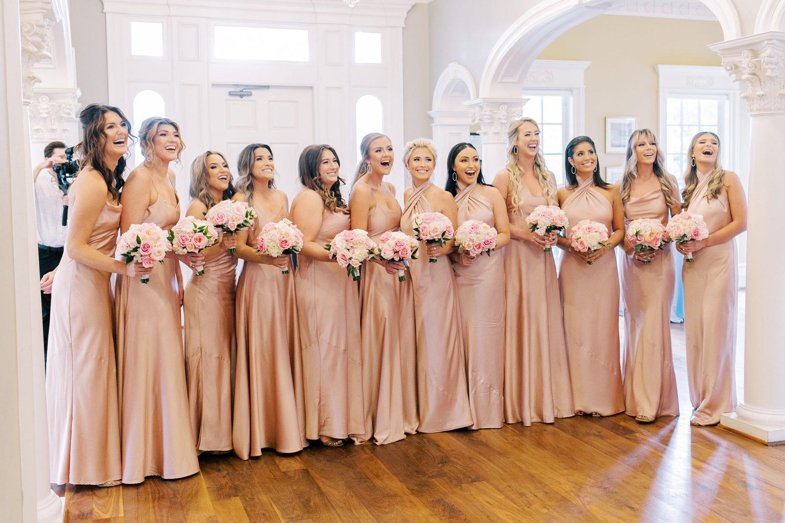 Alexa's bridesmaids laughing together on a staircase