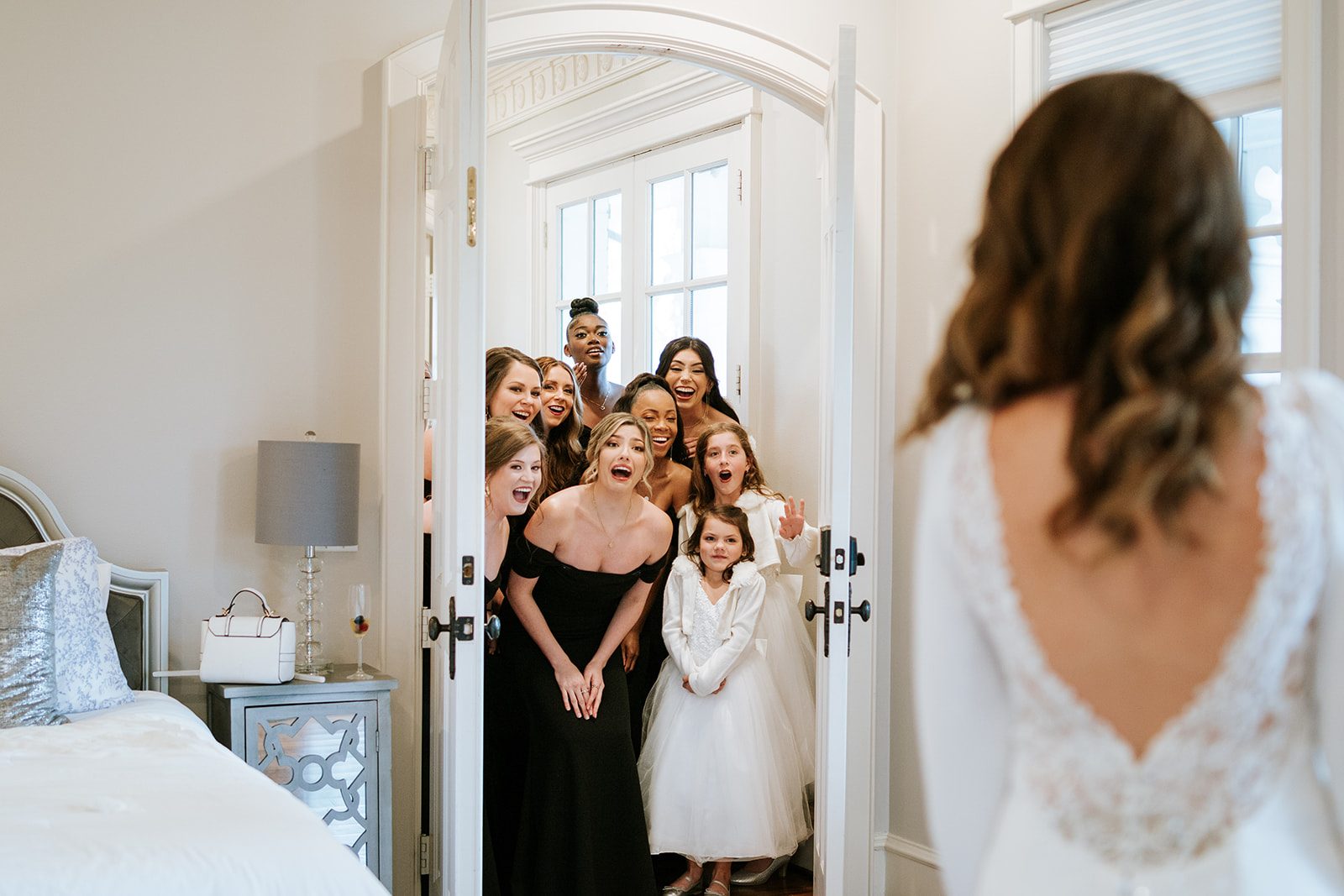 Bridal party reacting to seeing Alyssa in her dress for the first time