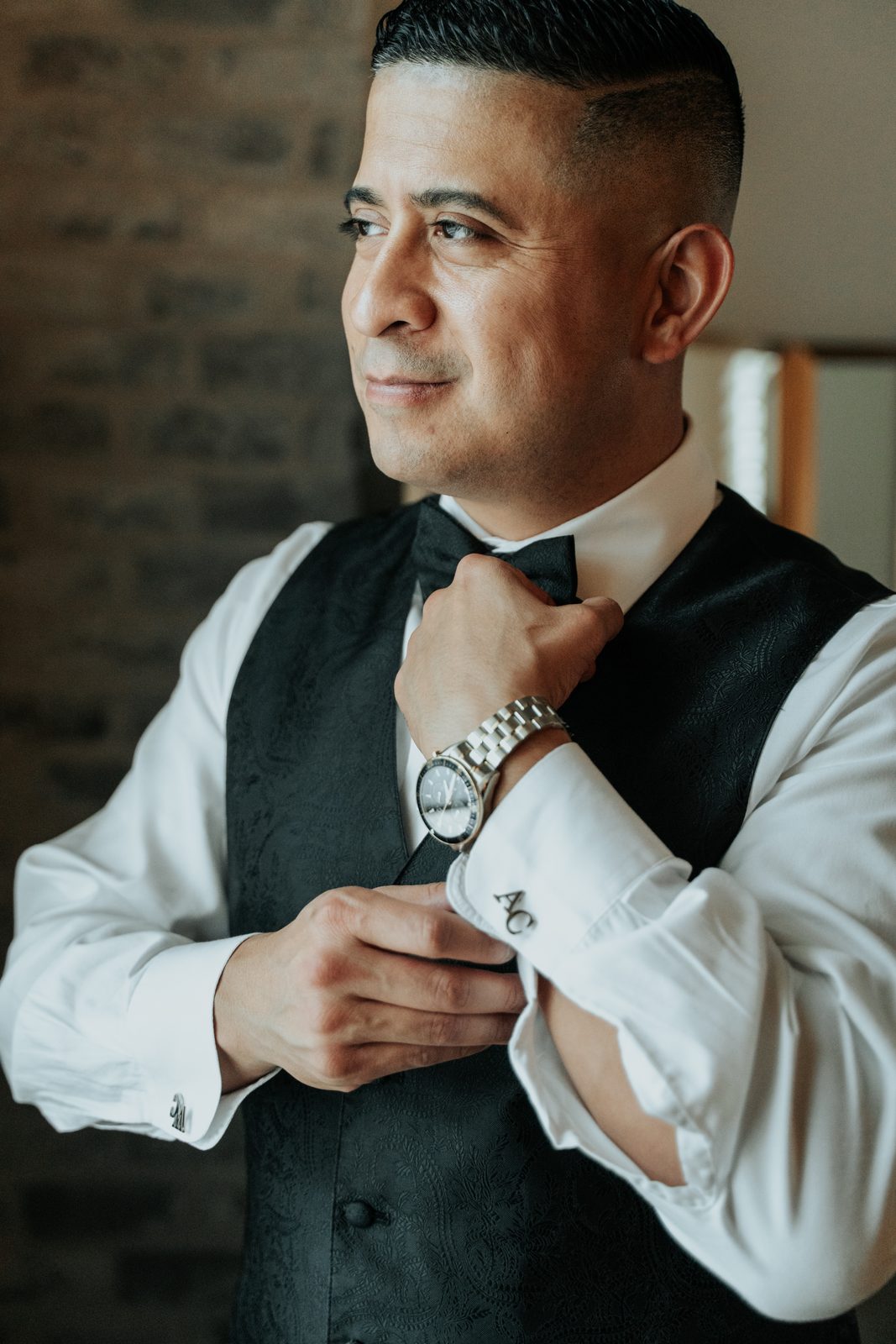 Walter adjusting his cufflinks while getting ready