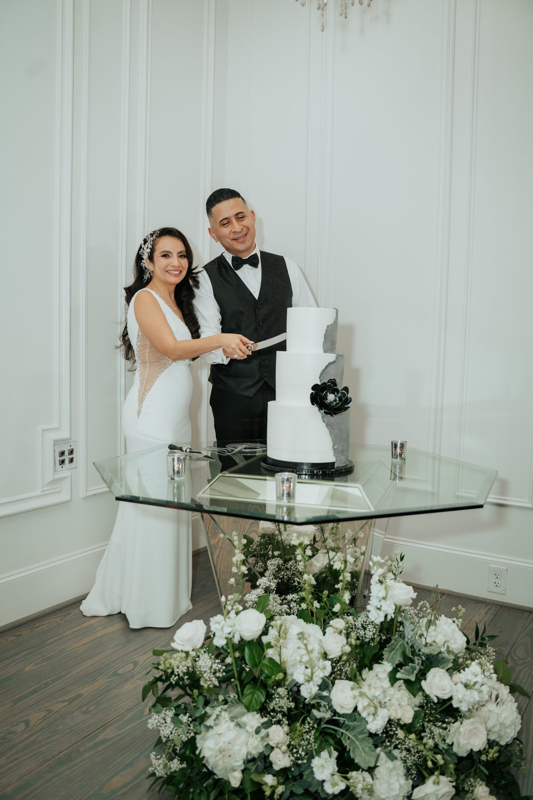Amber and Walter cutting their wedding cake