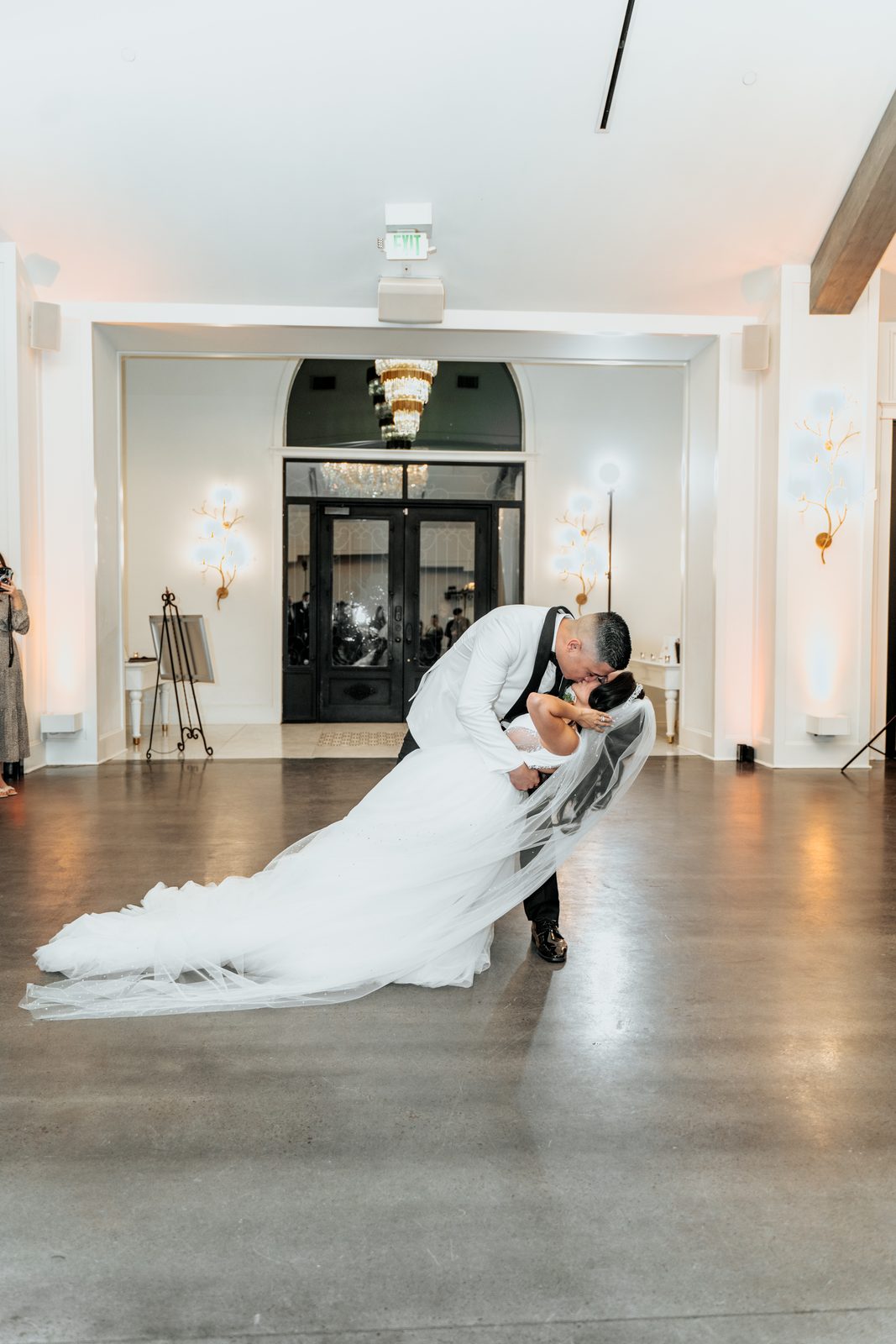 Walter dipping Amber for a kiss on the dance floor