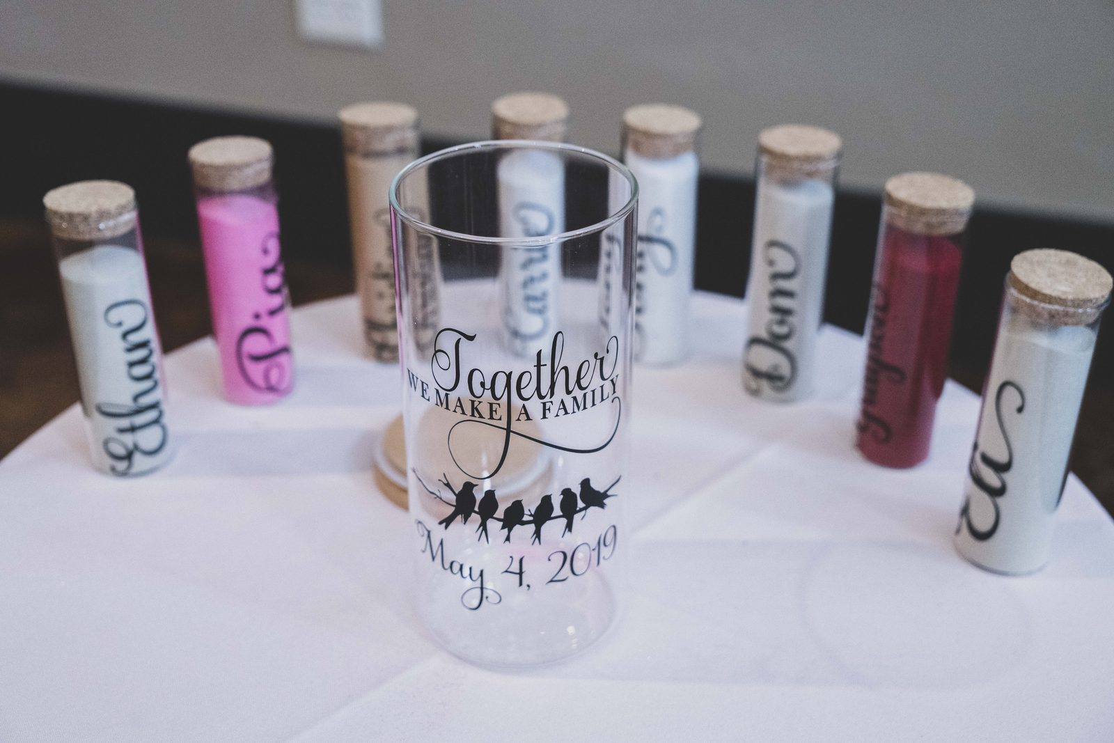 Personalized unity sand jars set up before the ceremony