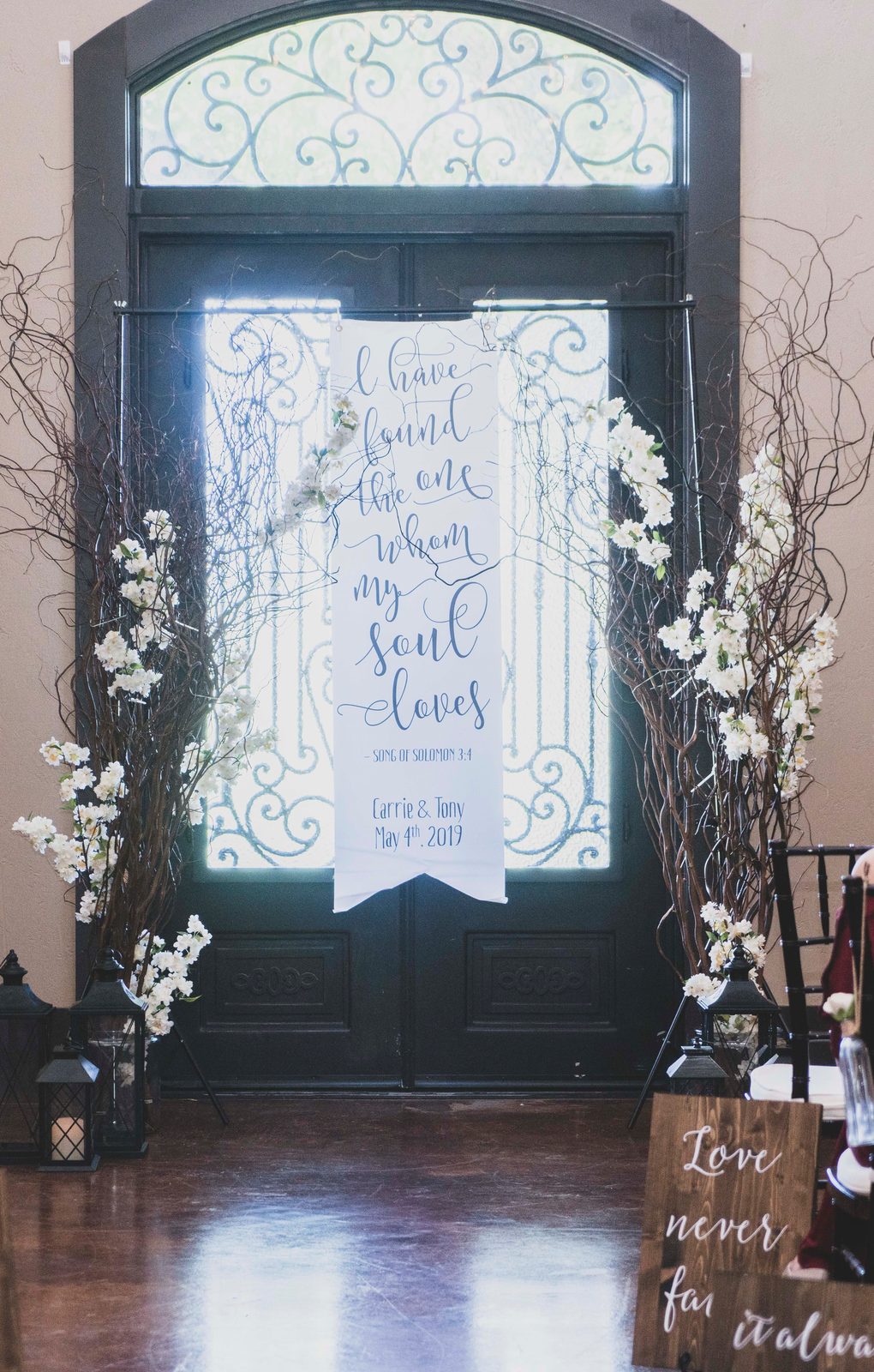 Ceremony entrance signage reading Carrie and Tony, May 4th