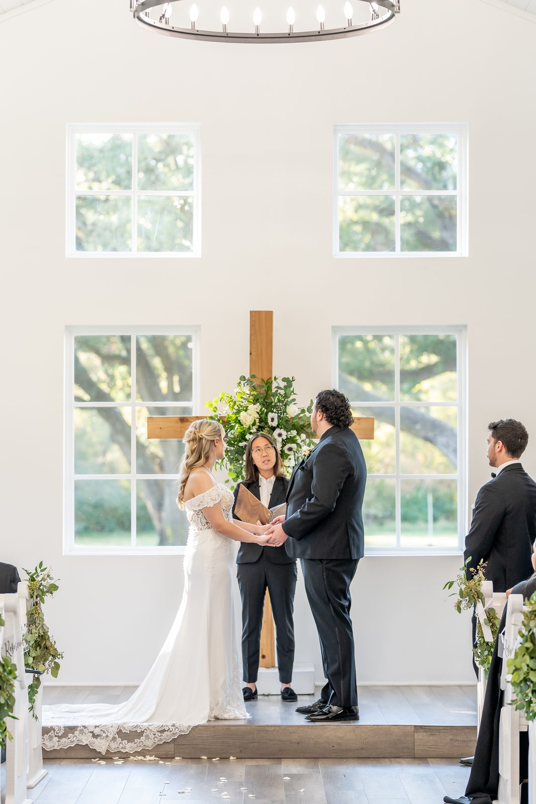Chris and Bailey exchanging vows at the altar