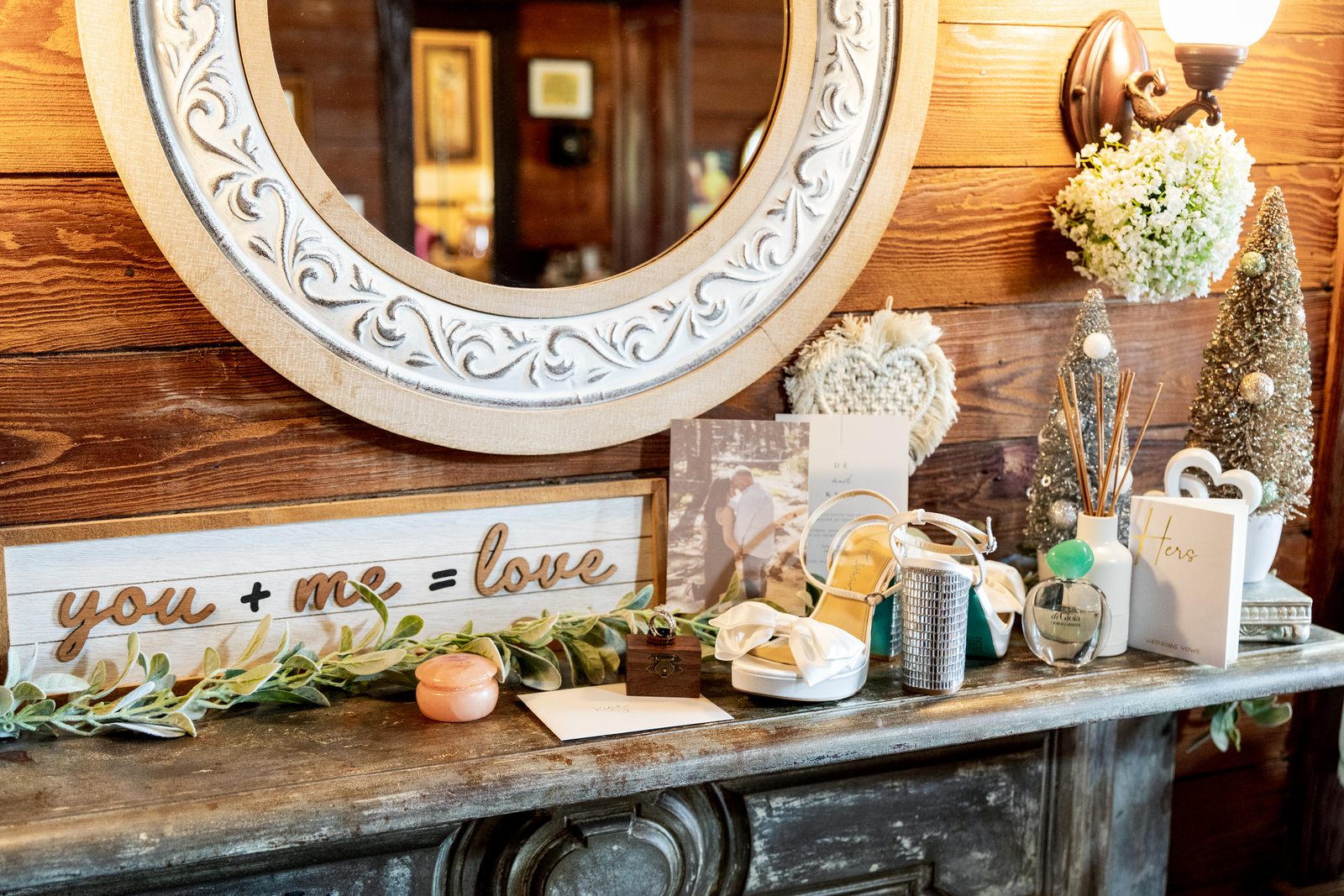 Mantel flatlay with a you plus me equals love sign