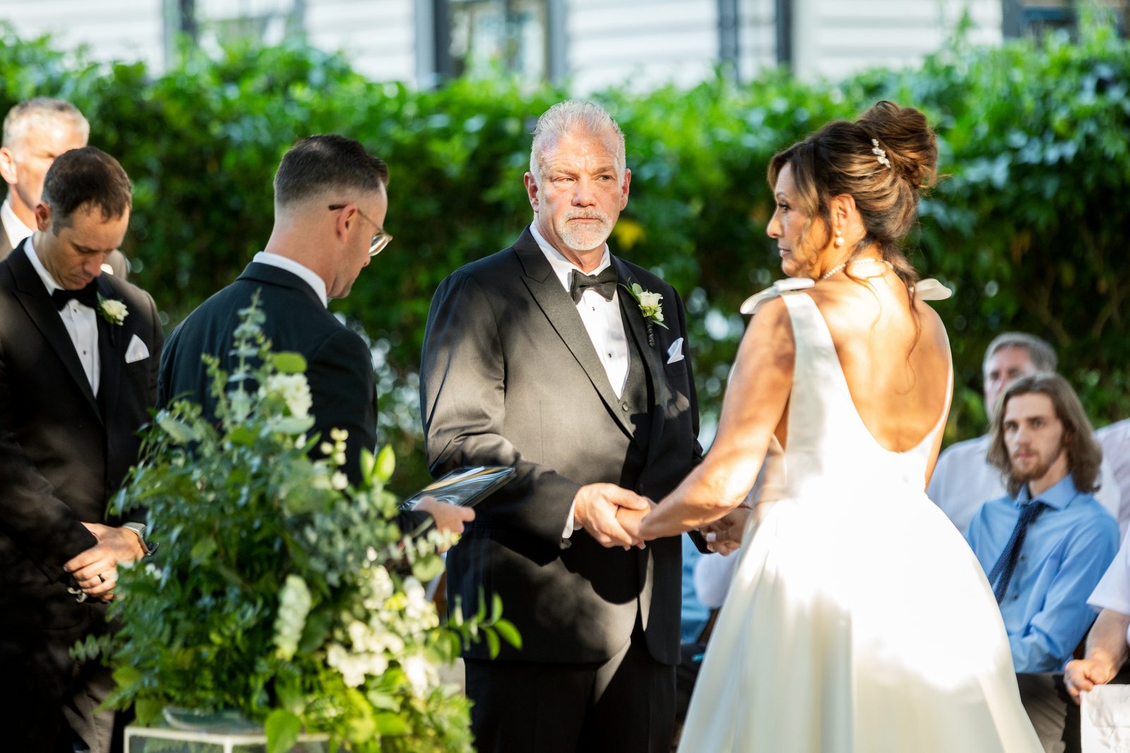 De and Kyle exchanging vows at the ceremony
