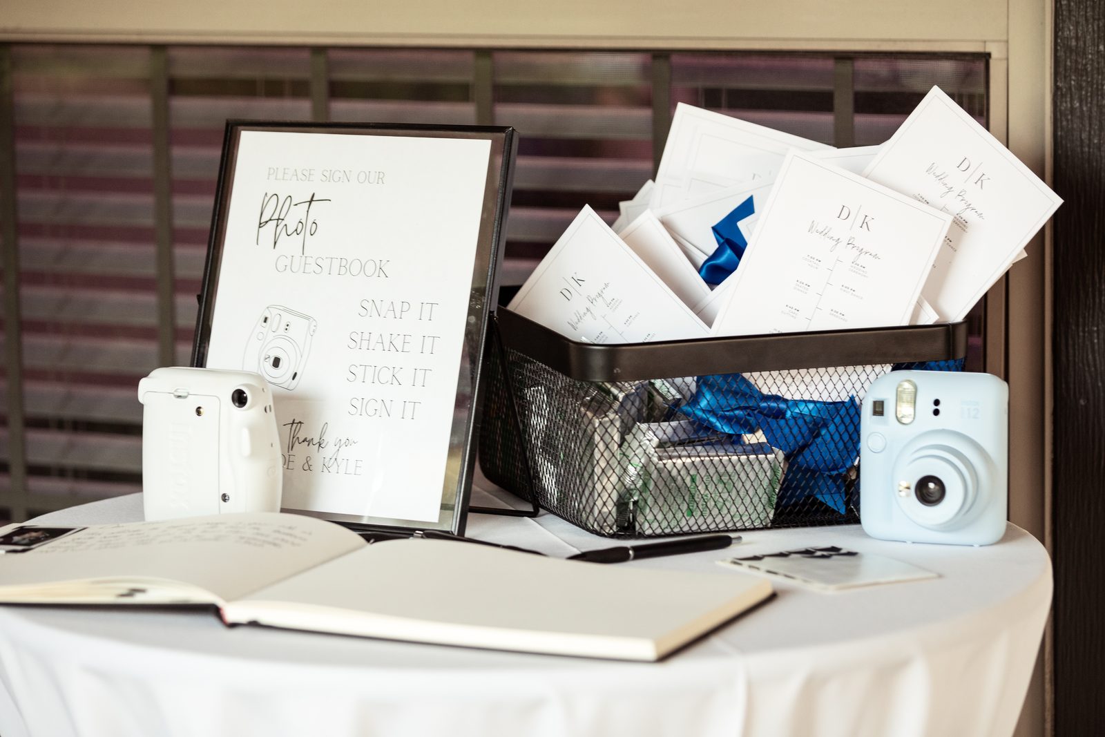 Photo guestbook table with instant cameras