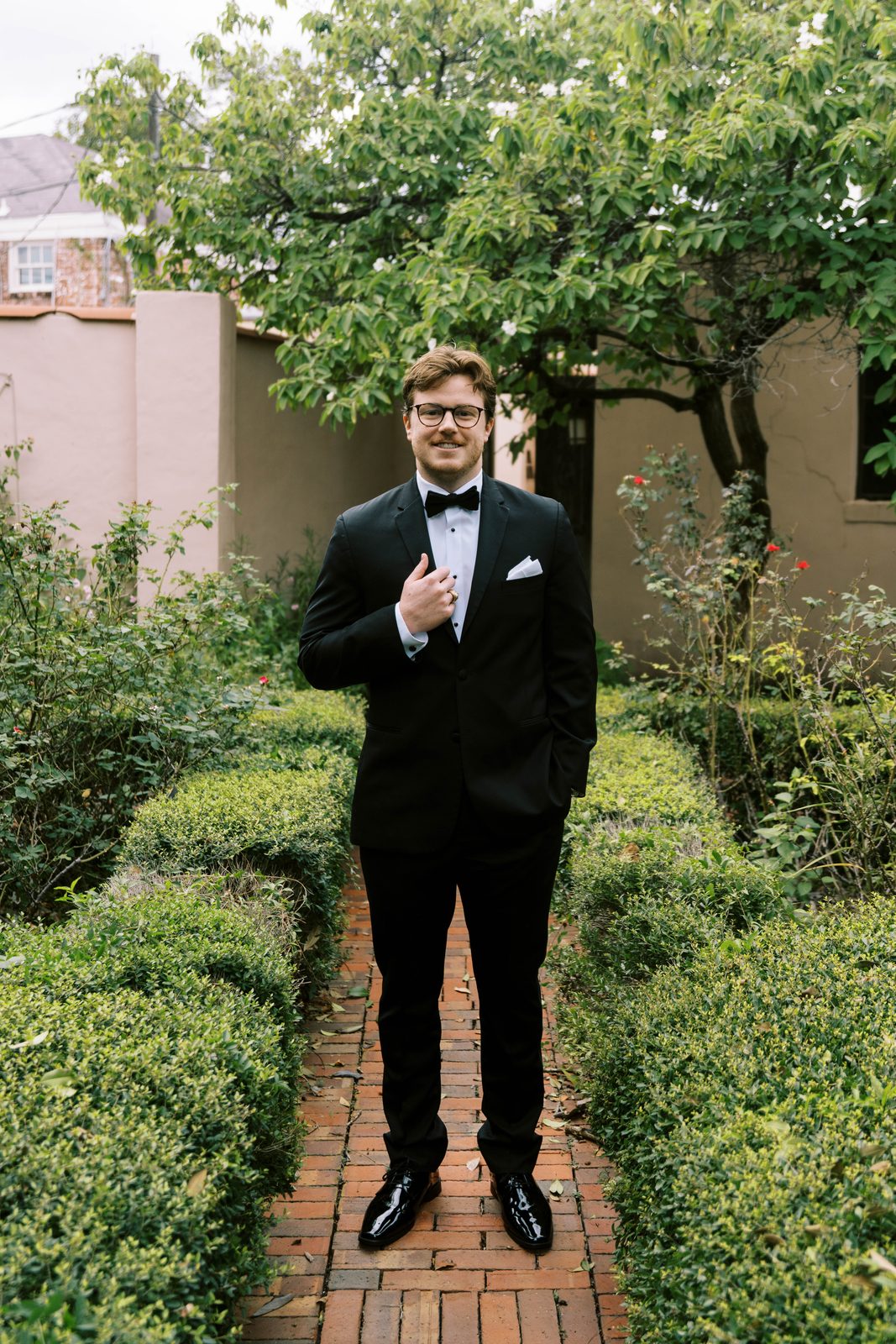 Tanner solo portrait in a garden courtyard