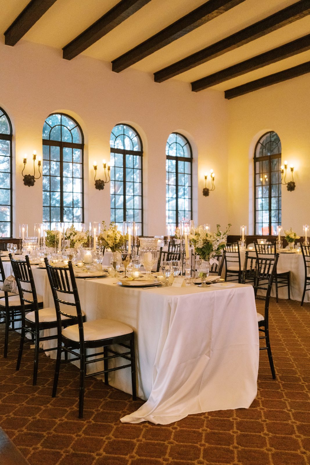 Reception room set with candlelight and arched windows