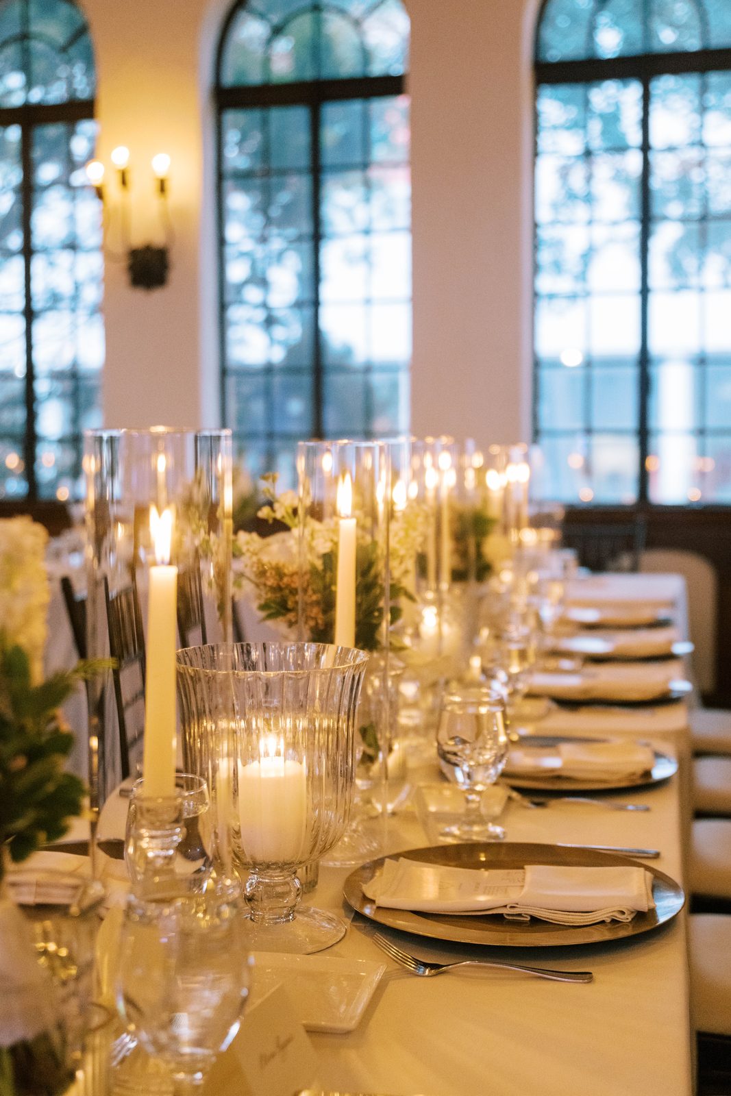 Table setting detail with tall taper candles