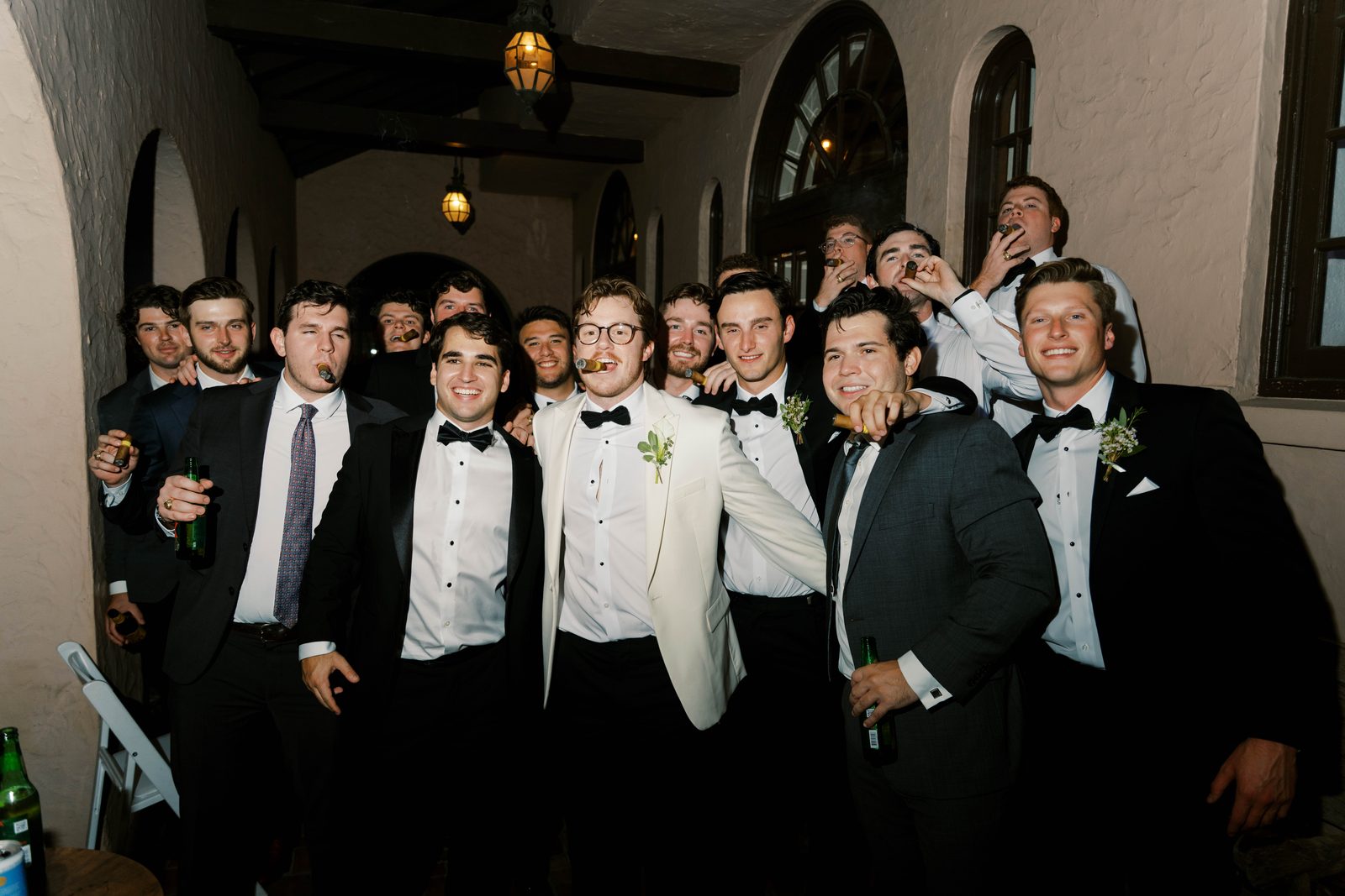 Tanner celebrating with groomsmen and cigars