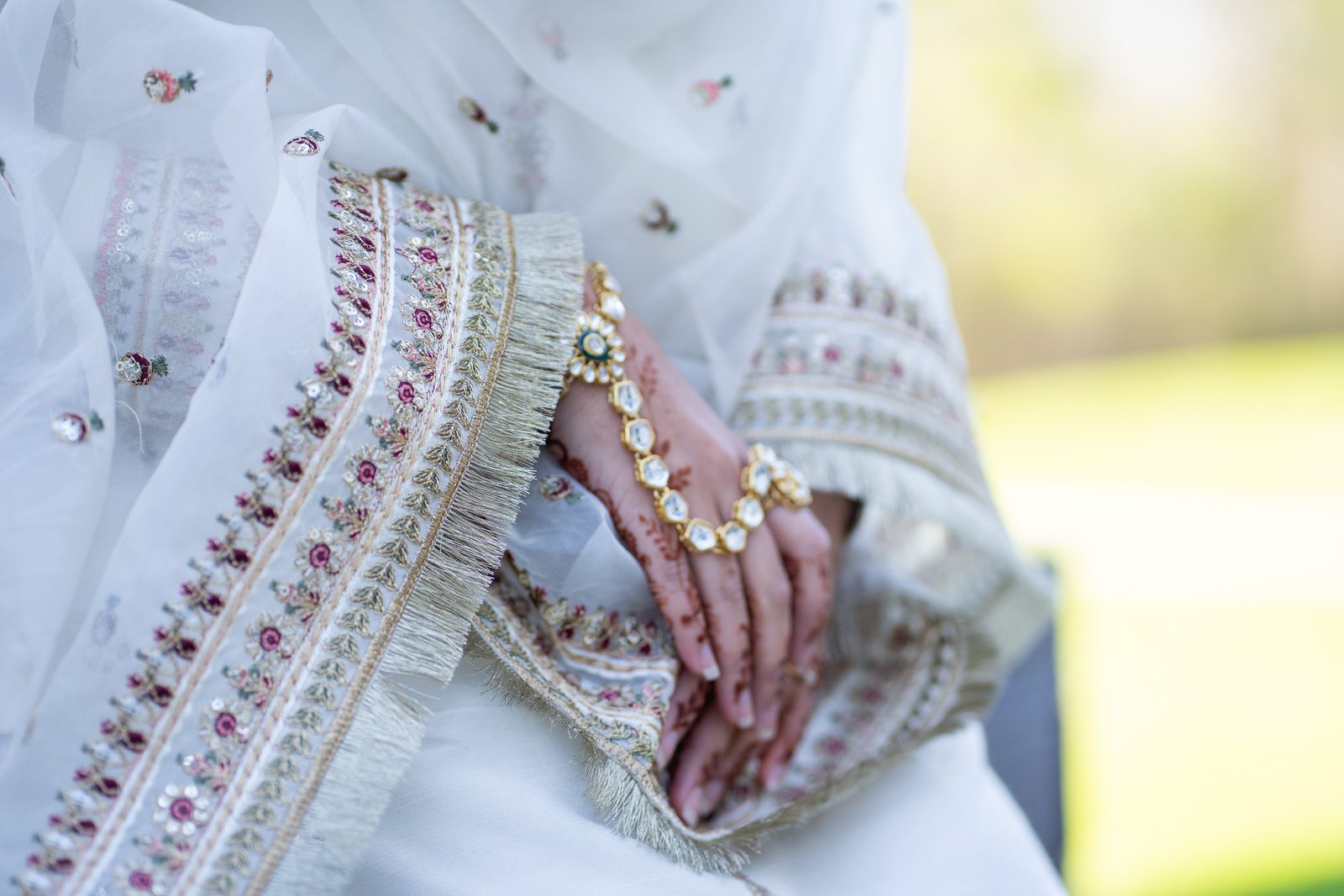 Detail of henna and gold bracelet on Maria's hands