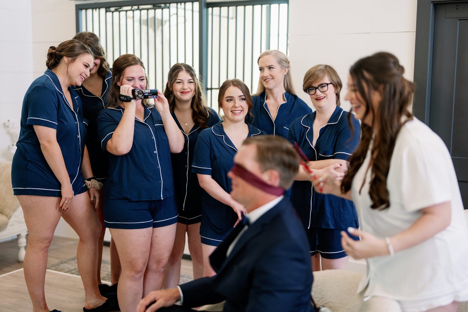 David blindfolded for a wedding-day game with the bridal party