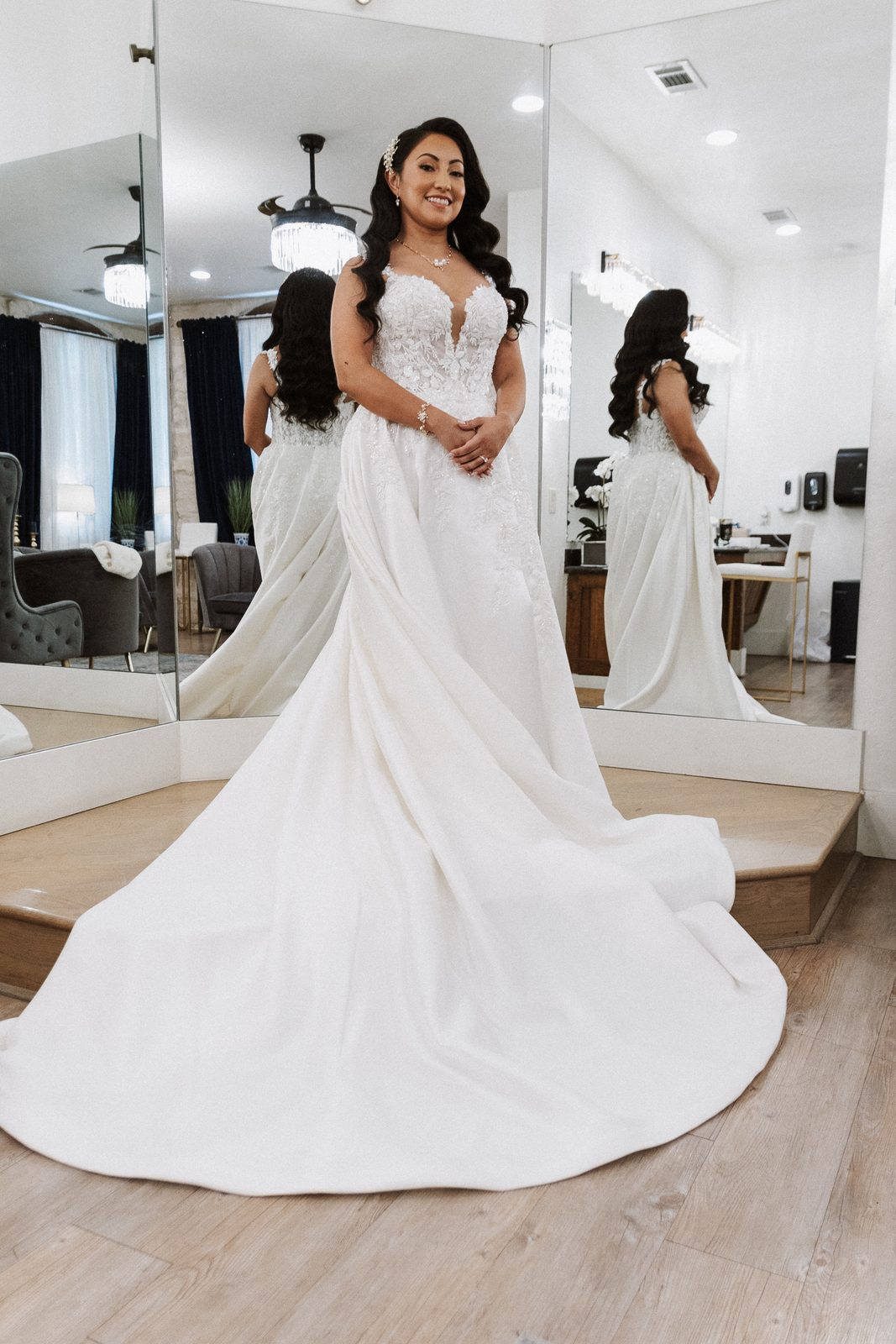 Perla in her wedding gown, reflected in a mirror