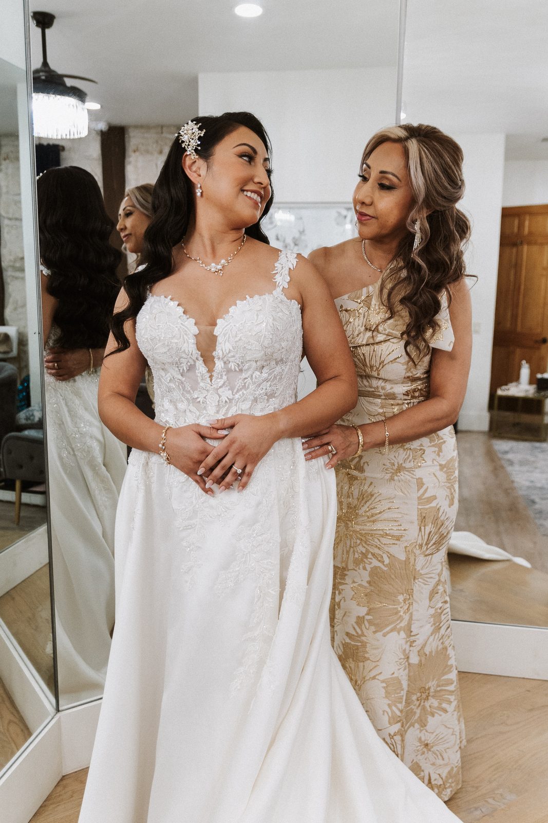 Perla and her mother sharing a moment before the ceremony