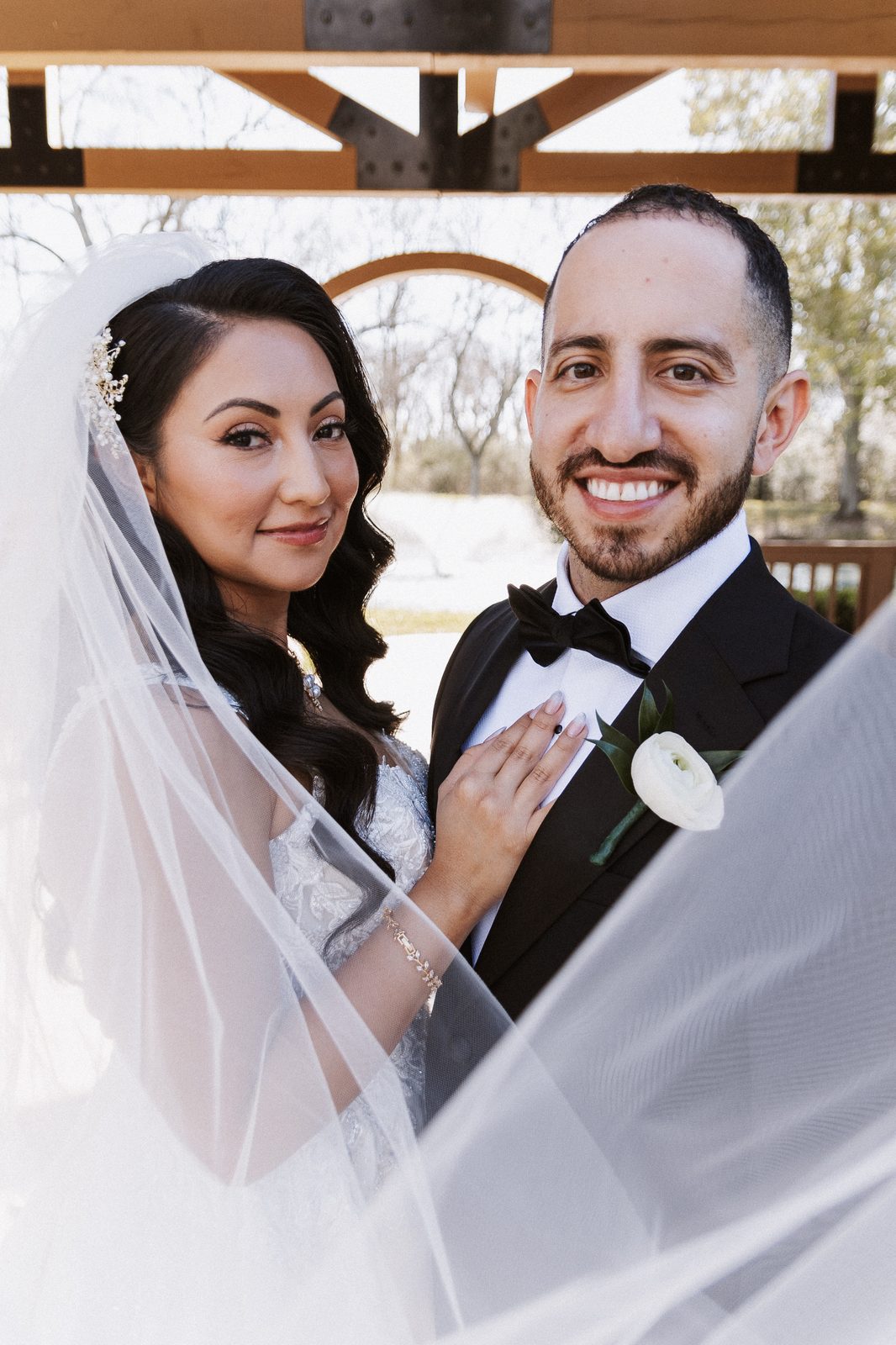 Close portrait of Perla and Steven under the pergola