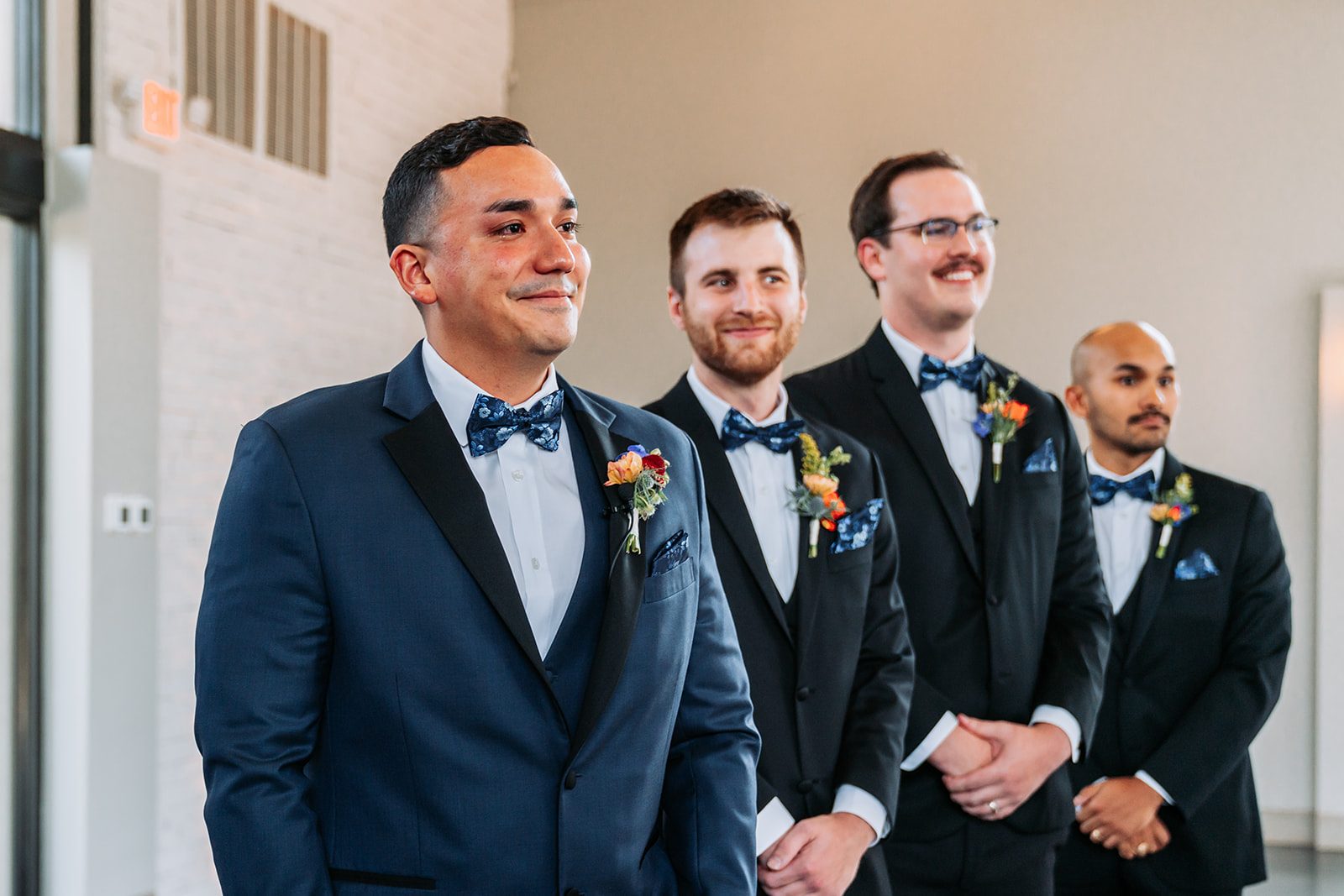 Gus and groomsmen watching Sara walk down the aisle