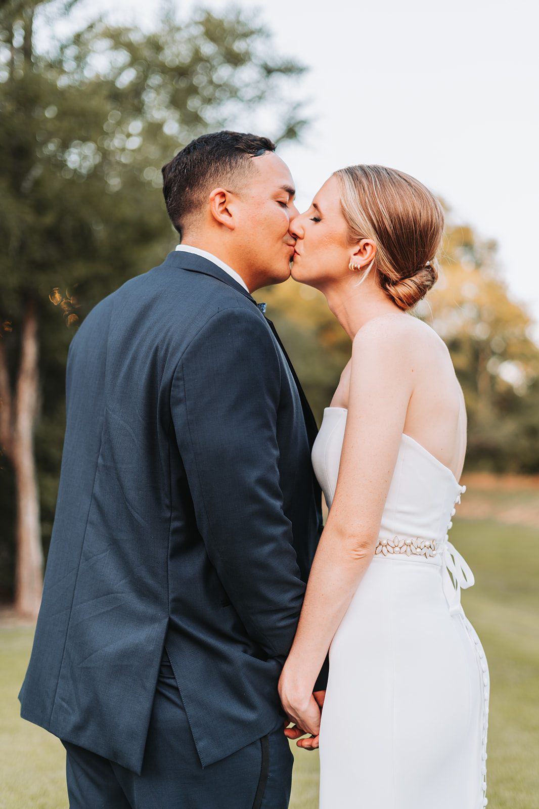 Sara and Gus portrait kissing at golden hour