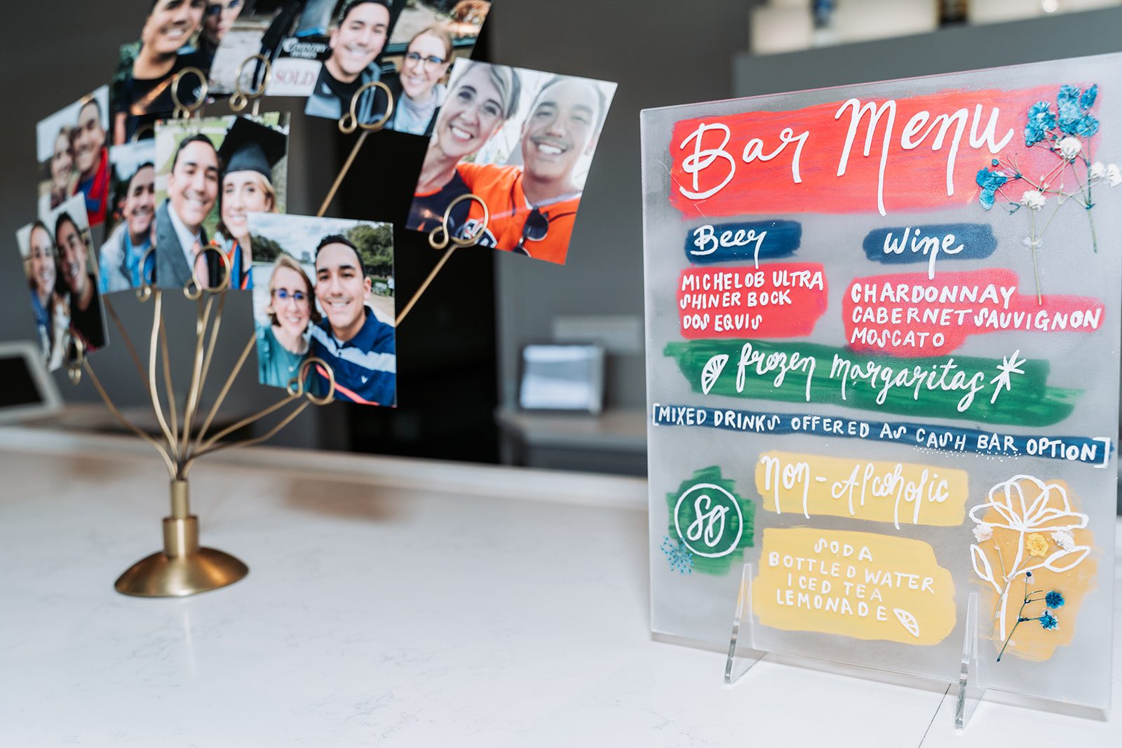 Photo memory tree and hand-painted bar menu at the reception